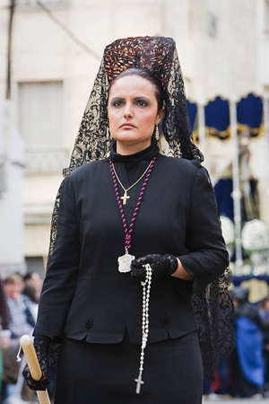 Woman dressed in mantilla during a procession of holy week, Spain