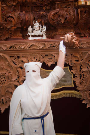Nazarene that goes with the hand on the manigueta the throne in a procession of holy week. Not...