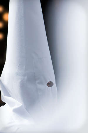 Penitent's profile in a procession of Holy week, Seville, Andalusia, Spainのeditorial素材