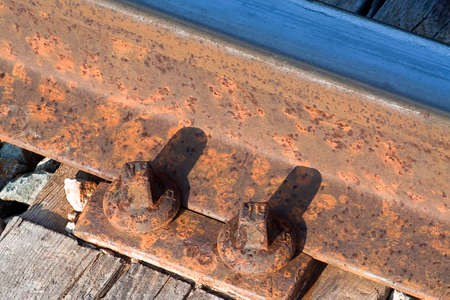 Detail of fastening with screws of an old railway trackの写真素材