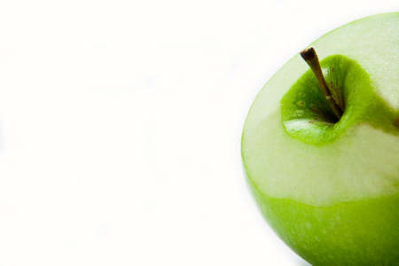 Green Apple freshly peeled isolated on white backgroundの写真素材