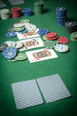 cards poker deck English, poker chips stack on green table 