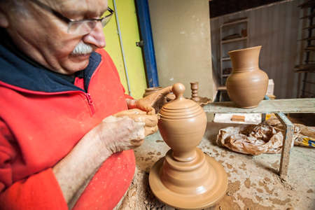 Potter making a jug of mud, clay pottery ceramics typical of BailÃ©n, Jaen province, Andalucia, Spainのeditorial素材