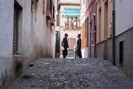 Granada, SPAIN - 16 february 2013  Two Moroccans speaking at the end of street in the AlbaicÃ­n, Granada, Andalusia, Spainのeditorial素材