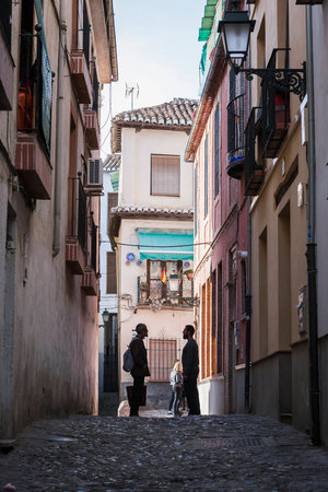 Granada, SPAIN - 16 february 2013  Two Moroccans speaking at the end of street in the AlbaicÃ­n, Granada, Andalusia, Spainのeditorial素材