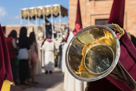 Linares, Jaen province, SPAIN - March 17, 2014  Nuestra SeÃ±ora de los Dolores going out of the church of Santa Maria, detail of typical elongated trumpet of this brotherhood, taken in Linares, Jaen province, Andalusia, Spainのeditorial素材