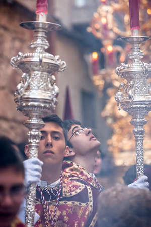 Acolytes with Dalmatian garb support candlesticks during a pretransfer of healthy week, Spainのeditorial素材