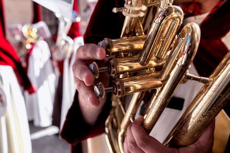 Penitents playing trumpets during Holy week in the good Friday procession, take in Linares, Jaen province, Spainの写真素材