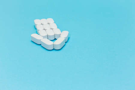 Arrow of Pills on blue backgroundの写真素材