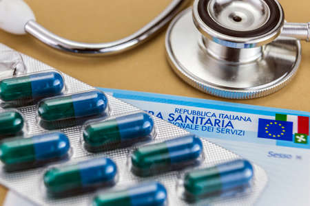 capsules up ticket euro and Italian health insurance card, concept of health copay