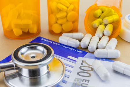 capsules up ticket euro and european health insurance card, concept of health copayの写真素材