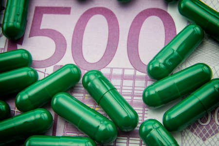 green capsules up ticket of 500 euros, concept of health copayの写真素材