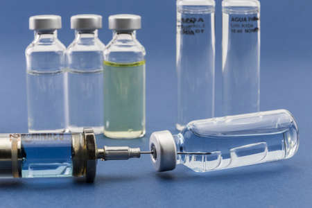 Medicine vials and syringe