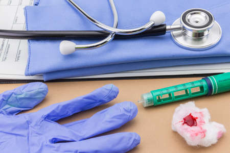 Insulin injecting pen and stethoscope, concept of diabetes