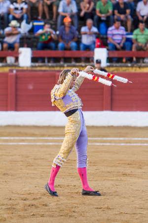Andujar, Spain - September 10, 2010: The Spanish Bullfighter Ivan Garcia with flags in each hand, classic of the taurine art movement in the Bullring of Andujar, Spainのeditorial素材
