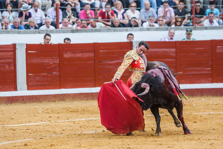 Pozoblanco, Spain - September 23, 2011: The Spanish Bullfighter Enrique Ponce bullfighting with the crutch in the Bullring of Pozoblanco, Spainのeditorial素材