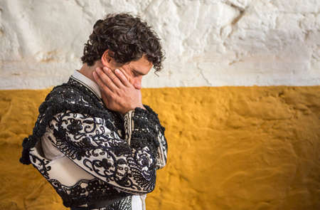 Andujar, SPAIN - September 7, 2014: Spainish bullfighter Miguel Abellan totally focused moments before leaving to fight in Bullring of Andujar, Spainのeditorial素材