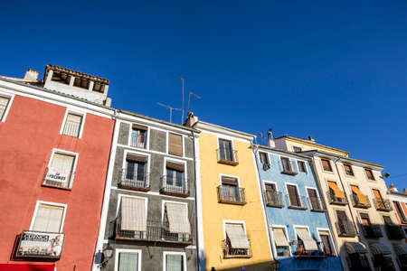 typical houses construction in the old town of the city of Cuenca, fronts painted with living colors, Cuenca, Spainのeditorial素材