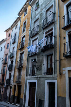 typical houses construction in the old town of the city of Cuenca, fronts painted with living colors, Cuenca, Spainのeditorial素材