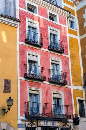 typical houses construction in the old town of the city of Cuenca, fronts painted with living colors, Cuenca, Spainのeditorial素材