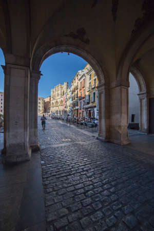 CUENCA, SPAIN - August 24, 2016: An arch leading to Plaza Mayor in Cuenca, Spainのeditorial素材