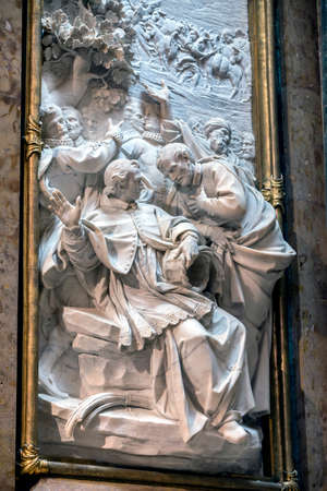 CUENCA, SPAIN - August 24, 2016: Inside of the Cathedral of basin, Chapel new of San Julian or the transparent, detail in marble white of San Julian is holding a basket while talks with its companion San Lesmes, while to the Fund in the part upper appearsのeditorial素材