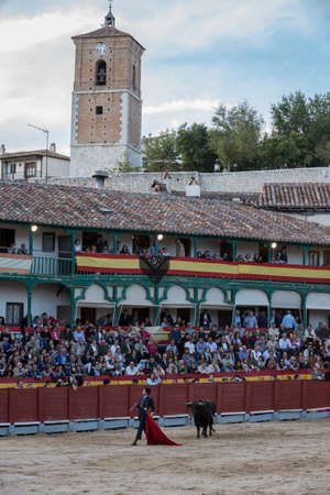 Chinchon, Spain - October 15, 2016: Traditional bullfighting stamp in the main square of chinchon during the festival charity, Chinchon, Madrid province, Spainのeditorial素材