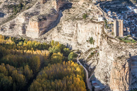 Alcala del Jucar, Spain - October 29, 2016: Panoramic view of the valley of the river Jucar during autumn, on top of limestone mountain is situated Castle of the 12TH century Almohad origin, take in Alcala of the Jucar, Albacete province, Spainのeditorial素材