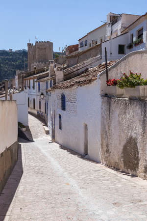 Alcala del Jucar, Spain - October 29, 2016: Narrow street with white painted houses, typical of this town, take in Alcala of the Jucar, Albacete province, Spainのeditorial素材