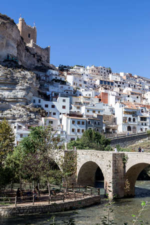 Alcala del Jucar, Spain - October 29, 2016: Roman bridge, located in the central part of the town, to its passage by the river Jucar, at the top of mountain limestone is situated castle of Almohad origin of the century XII, take in Alcala of the Jucar, Alのeditorial素材