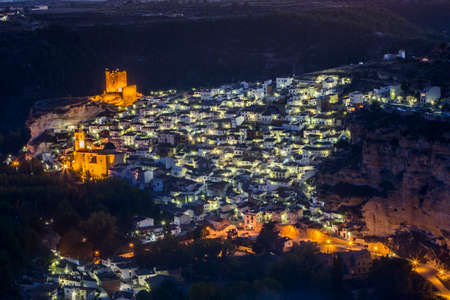 Alcala del Jucar, Spain - October 29, 2016: Night view of the city, on top of limestone mountain is situated Castle of the 12TH century Almohad origin, take in Alcala of the Jucar, Albacete province, Spainのeditorial素材