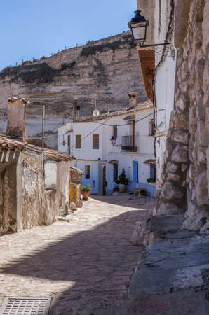 Alcala del Jucar, Spain - October 29, 2016: Narrow street with white painted houses, typical of this town, take in Alcala of the Jucar, Albacete province, Spainのeditorial素材