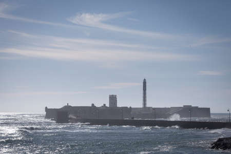 Cadiz Spain- April 1: Castle of San Sebastian, fortress on a smail island separated from the main city, according classical tradition, there was a Temple of Kronos, cultural landmark of the city, Cadiz, Spainのeditorial素材