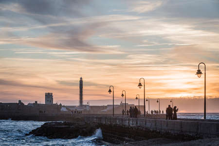Cadiz Spain- April 1: Castle of San Sebastian at sunset, fortress on a smail island separated from the main city, according classical tradition, there was a Temple of Kronos, cultural landmark of the city, Cadiz, Spainのeditorial素材