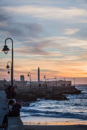Cadiz Spain- April 1: Castle of San Sebastian at sunset, fortress on a smail island separated from the main city, according classical tradition, there was a Temple of Kronos, cultural landmark of the city, Cadiz, Spainのeditorial素材