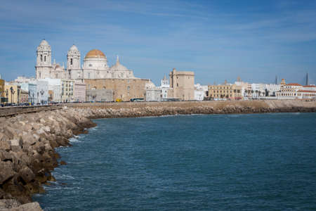 Cadiz, Spain - March 31: Panoramic view of the city on March, bordered by the Mediterranean sea and its Cathedral, called Catedral Nueva by locals, in the background, take in Cadiz, Andalusia, Spainのeditorial素材