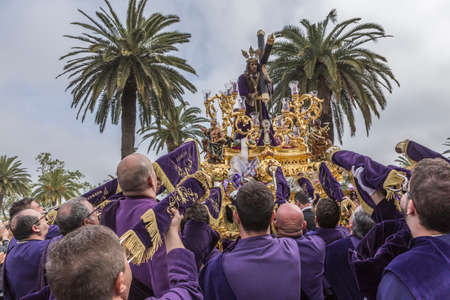 Penitents playing trumpets during Holy week in the good Friday procession, take in Linares, Jaen province, Spainのeditorial素材