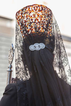 Woman dressed in mantilla during a procession of holy week, Spainの写真素材