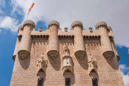 Segovia, SPAIN - June 3: Partial view of the Castle from the entrance to the monument and drawbridge, Juan II Tower, rising out on a rocky crag, built in 1120, Segovia, Castilla y Leon, Spainのeditorial素材