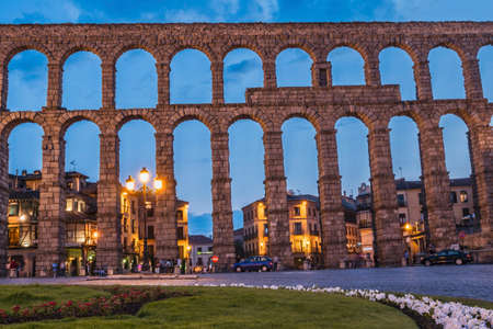 Partial view of the Roman aqueduct located in the city of Segovia at night , Unesco World Heritage Site, Spainのeditorial素材