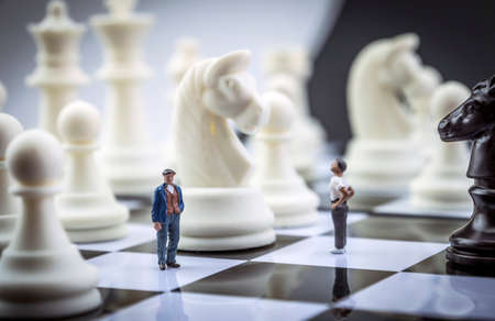 Man thumbnail within a game of chess, conceptの写真素材
