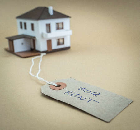 Small house with tag marked for saleの写真素材