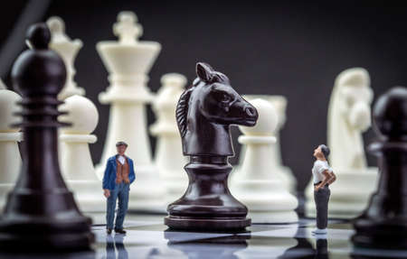 Man thumbnail within a game of chess, conceptの写真素材