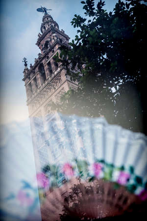 View of the Giralda reflected in a showcase, Seville, Andalusia, Spainの写真素材