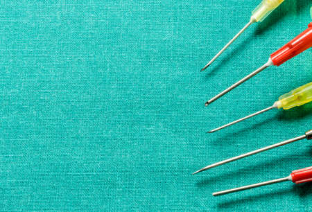 Set Of Metallic Needles Of Different Size On Operations Tableの写真素材