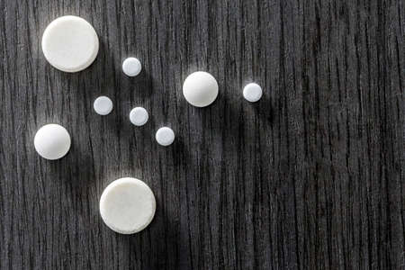 Some Round White Pills Of Different Sizeの写真素材