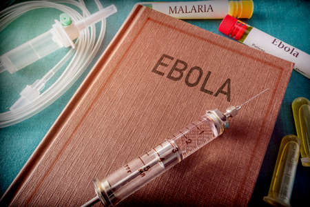 Vintage Syringe On A Book Of Ebola, Medical Conceptの写真素材