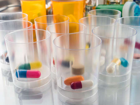 Daily medication at a hospital table, conceptual imageの写真素材