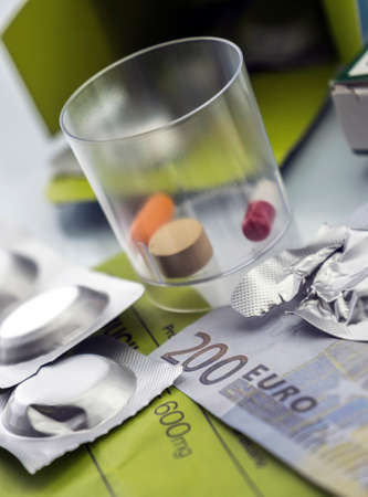 Pastilla effervescent next to medication daily on a ticket of 200 euros, concept of copayment healthの写真素材