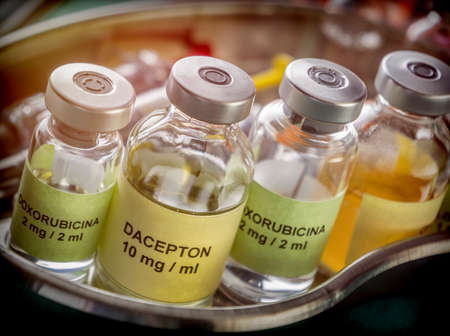Vials of different size with medication used for neurodegenerative diseases, conceptual image